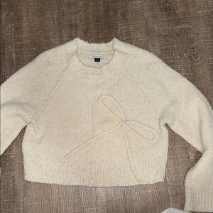 American Eagle Outfitters Cream Sweater with Bow Accent